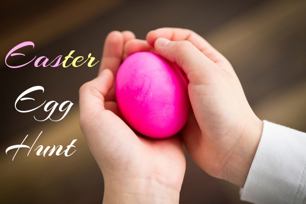 A child's hands holding a pink egg with the words "Easter Egg Hunt".