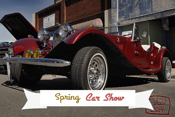 Classic car with "Spring Car Show" banner.